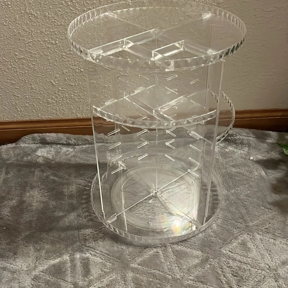 360° spinning skincare/makeup organizer. clear plastic.